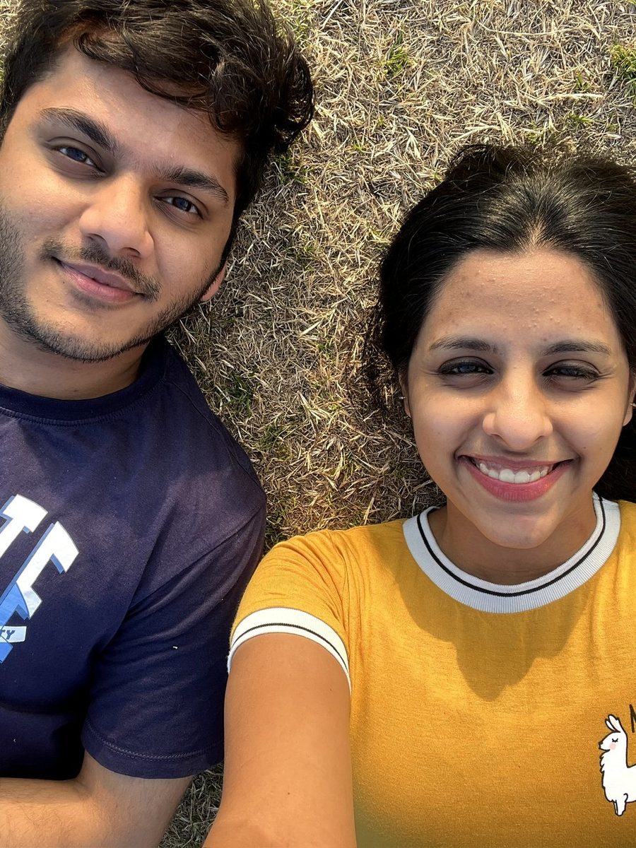 Harini and Chinmay lying on the grass